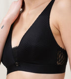 Triumph Aura Spotlight non-wired bra in black second model close-up side view, showing fit and the comfortable wireless design. Find Now Online