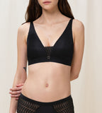Triumph Aura Spotlight non-wired bra in black second model front view, highlighting the plunging lace neckline and comfortable wireless design. Find Now Online