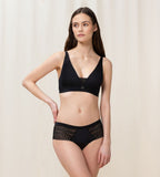 Triumph Aura Spotlight non-wired bra in black second model full front view, showing the plunging lace neckline and comfortable wireless design. Find Now Online