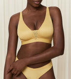 Triumph Aura Spotlight non-wired bra in yellow model front view, showcasing the vibrant floral lace and supportive wireless design. Shop the Latest Online