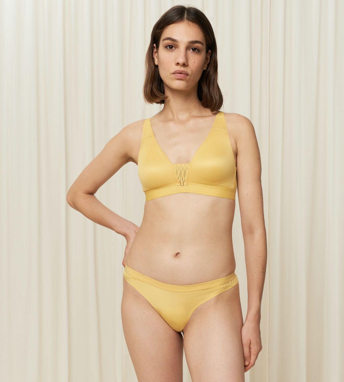 Triumph Aura Spotlight non-wired bra in yellow second model full front view, showcasing the vibrant floral lace and supportive wireless design. Shop the Latest Online
