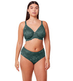 Triumph Aura Spotlight wired bra in Smoky Green model front view, showcasing the graphic lace cups and mesh side wings. Available Today Online