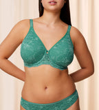 Triumph Aura Spotlight wired bra in green model front view, showcasing the graphic lace cups and supportive underwired design. Shop Online Today