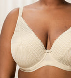 Triumph Aura Spotlight wired padded bra in light beige second model close-up view, showing details of the lace-overlaid cups and comfortable underwired design. Shop Now Online