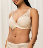 Triumph Aura Spotlight wired padded bra in light beige third model front view, showing the lace-overlaid cups and comfortable underwired design. Shop Now Online
