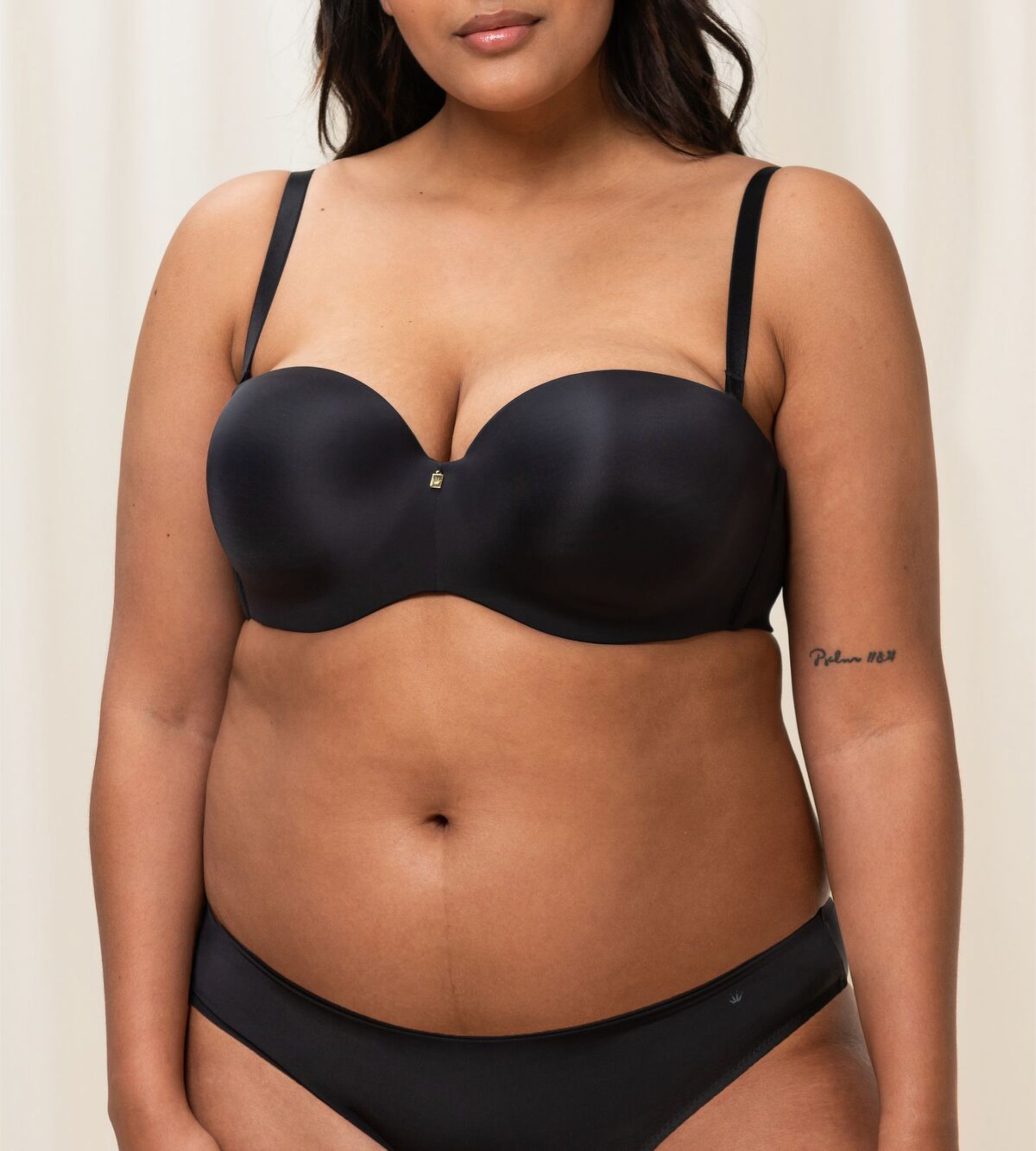 Triumph Body Make-Up Essentials Black multi-strap bra third model front view, highlighting the smooth cups and detachable strap system. Shop the latest Online