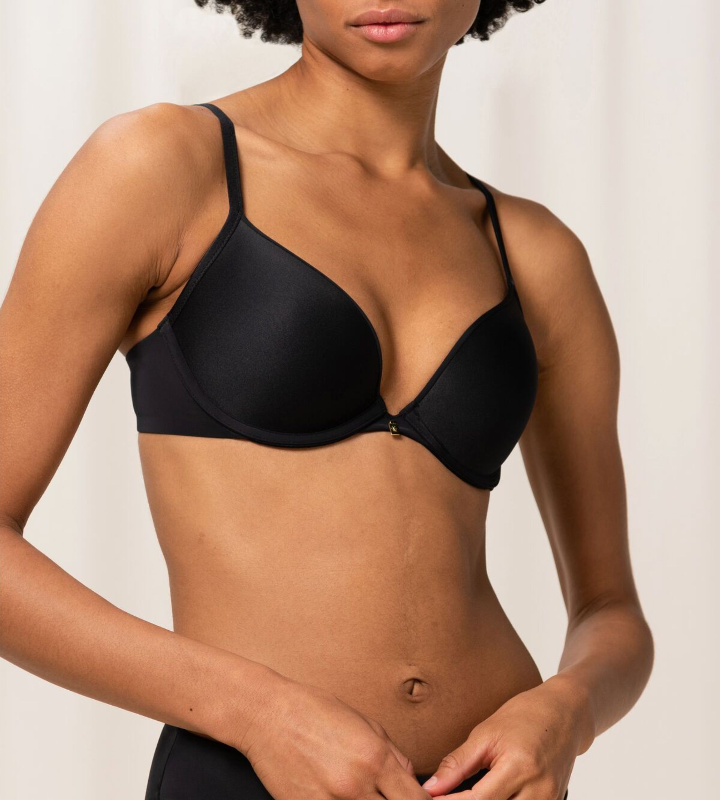 Triumph Body Make-Up Essentials black wired push-up bra second model front view, showcasing the smooth cups and plunging neckline. Order Online Today