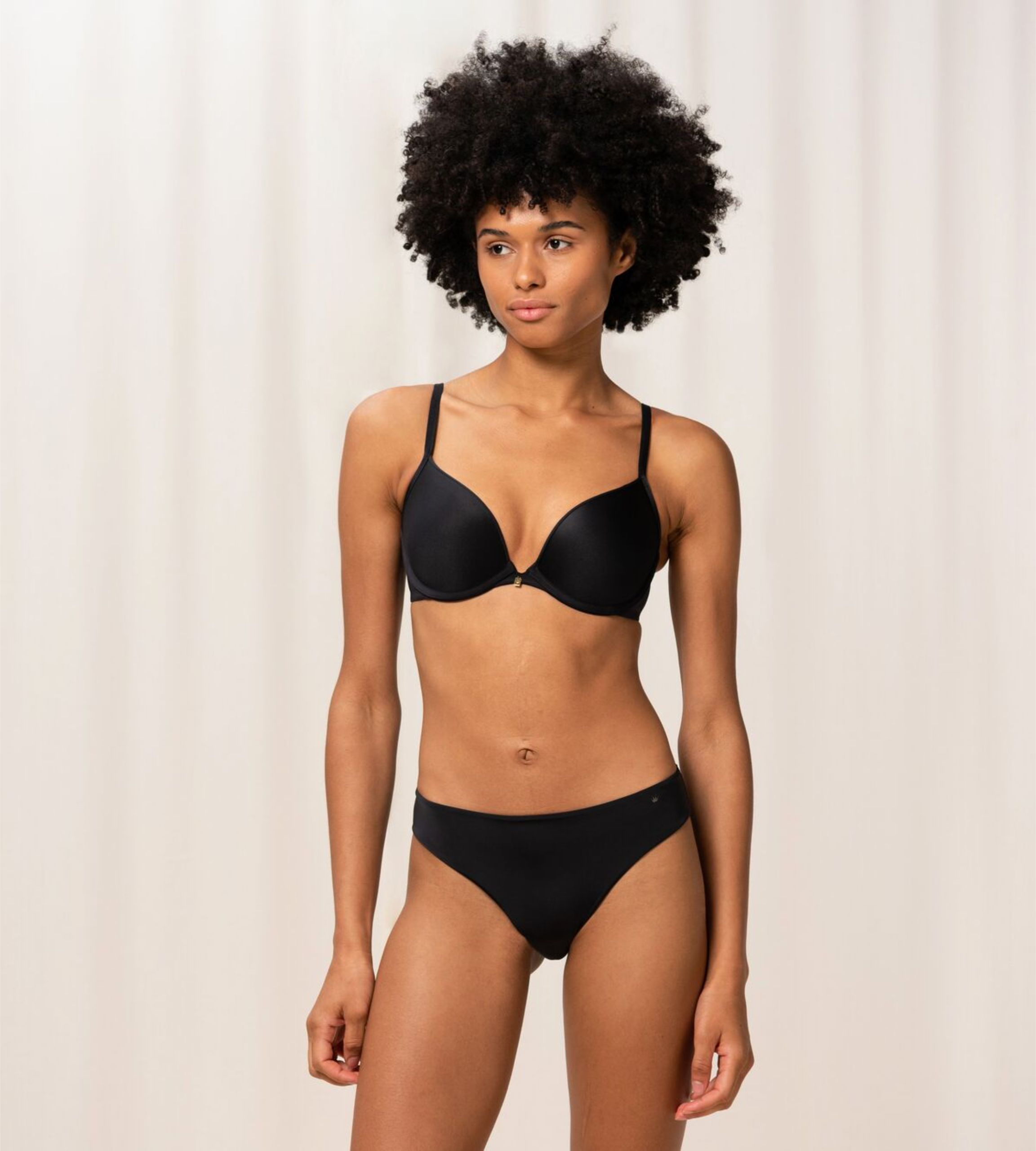 Triumph Body Make-Up Essentials black wired push-up bra second model full front view, showcasing the smooth cups and plunging neckline. Order Online Today