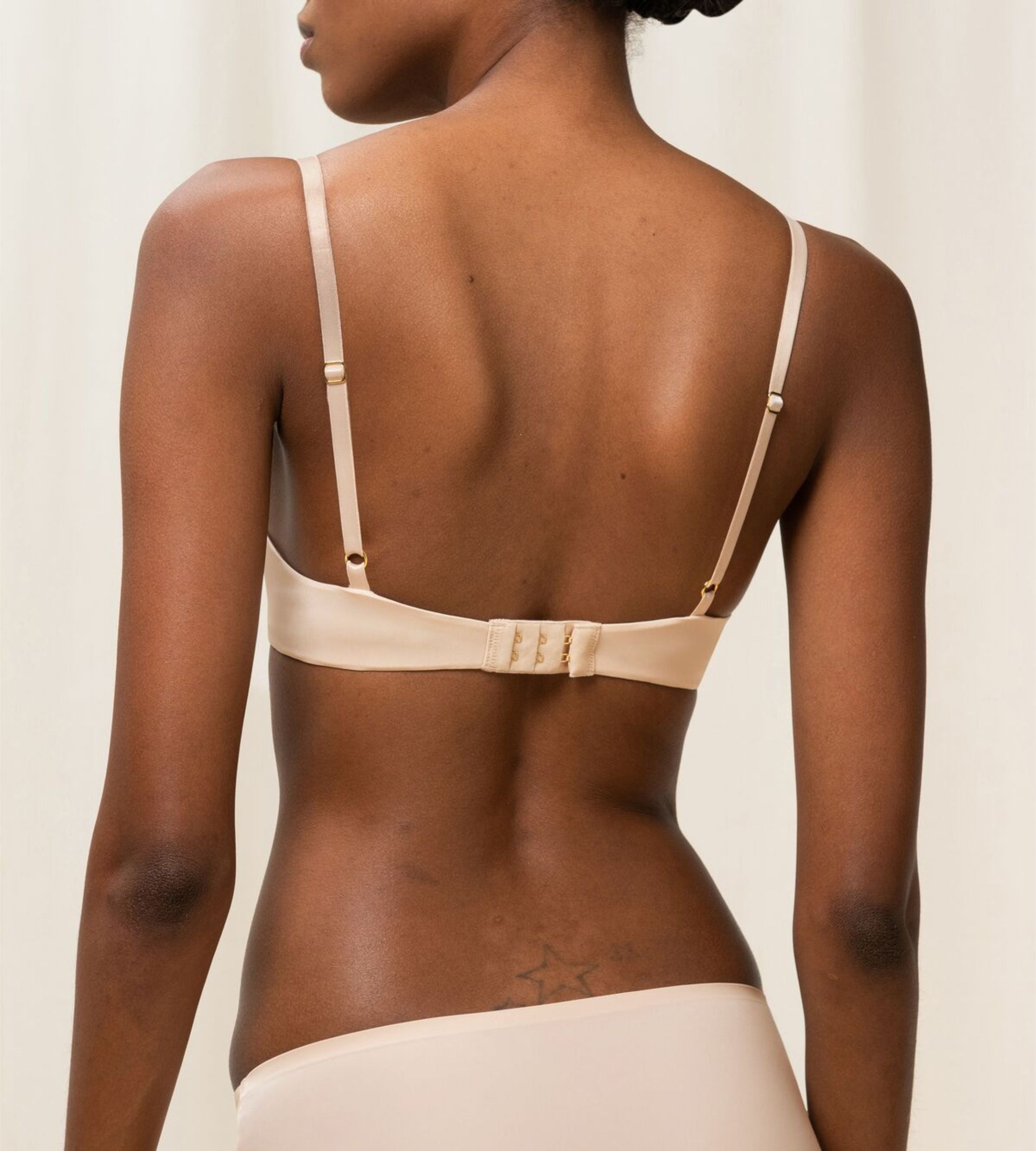 Triumph Body Make-Up Essentials multi-option bra in nude beige model back view, showcasing the  convertible strap design. Available Now Online