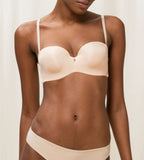 Triumph Body Make-Up Essentials multi-option bra in nude beige model front view, showcasing the smooth cups and convertible strap design. Available Now Online