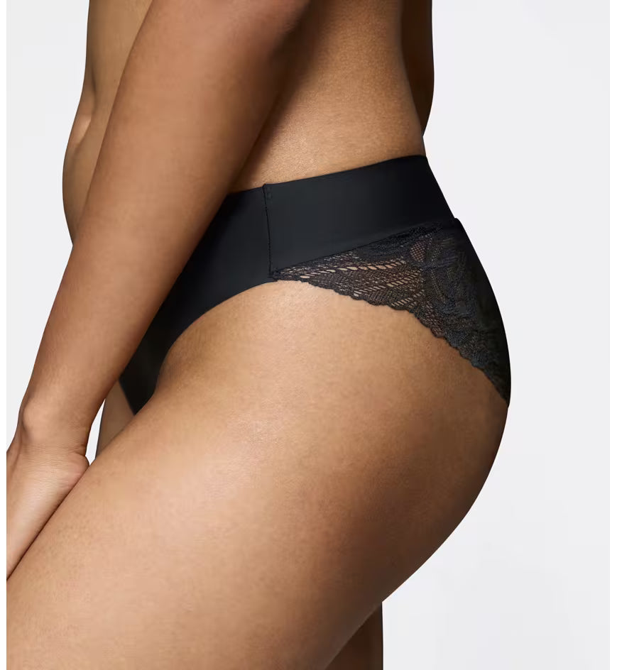 Triumph Body Make-Up Illusion Black lace tai panty model close-up side view, highlighting the high-cut leg and seamless lace finish. Available for Online Purchase