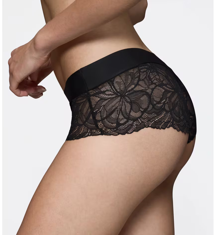 Triumph Body Make-Up Illusion black lace shorts panty model close-up side view, detailing the floral lace and seamless waistband. Available Online at Blue Salon Qatar