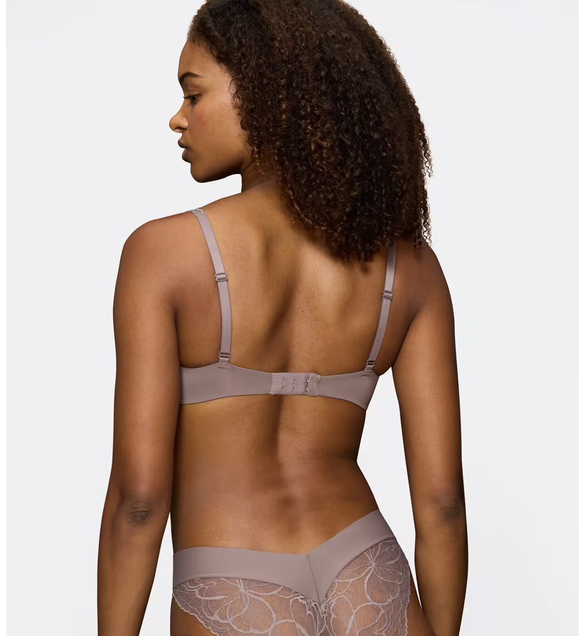 Triumph Body Make-Up Illusion lace grey wired padded bra model back view, showcasing the adjustable straps. Find Online Today