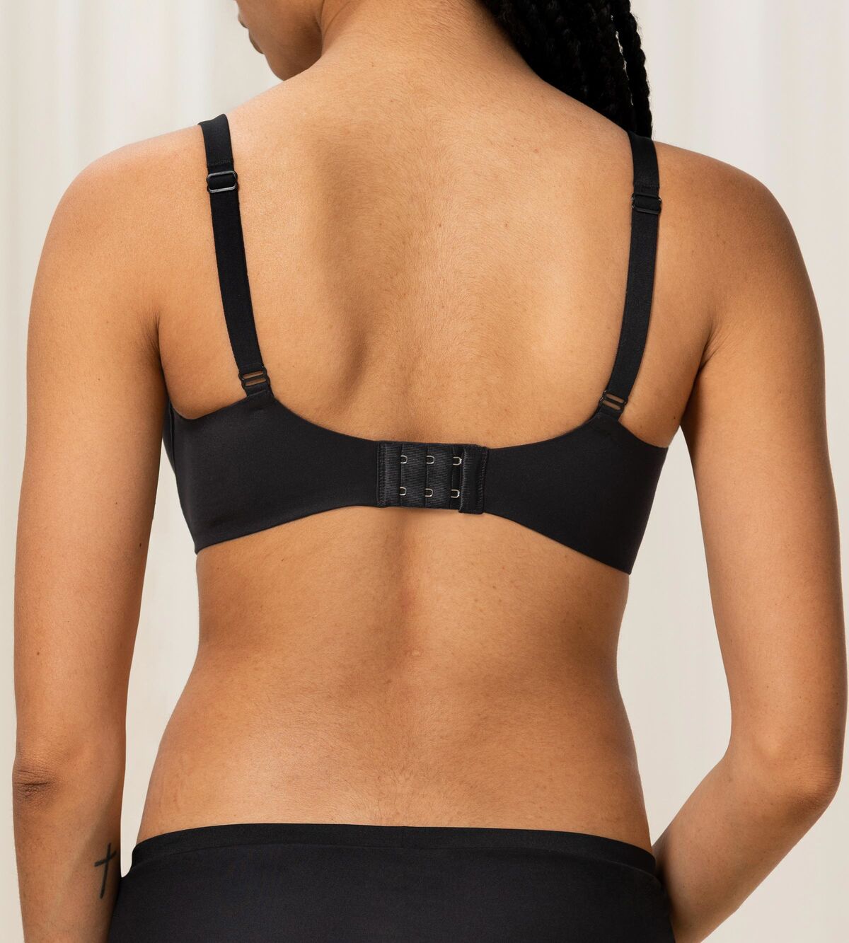 Triumph Body Make-Up Soft Touch black wired padded bra model back view, showing the comfortable strap design. Shop Online Today