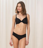 Triumph Body Make-Up Soft Touch black wired padded bra second model full front view, showing the smooth cups and comfortable strap design. Shop Online Today
