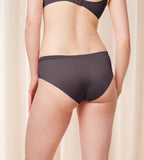 Triumph Body Make-Up Soft Touch grey hipster panty model back view, showing the seamless edges and soft-touch fabric. Find Online Now