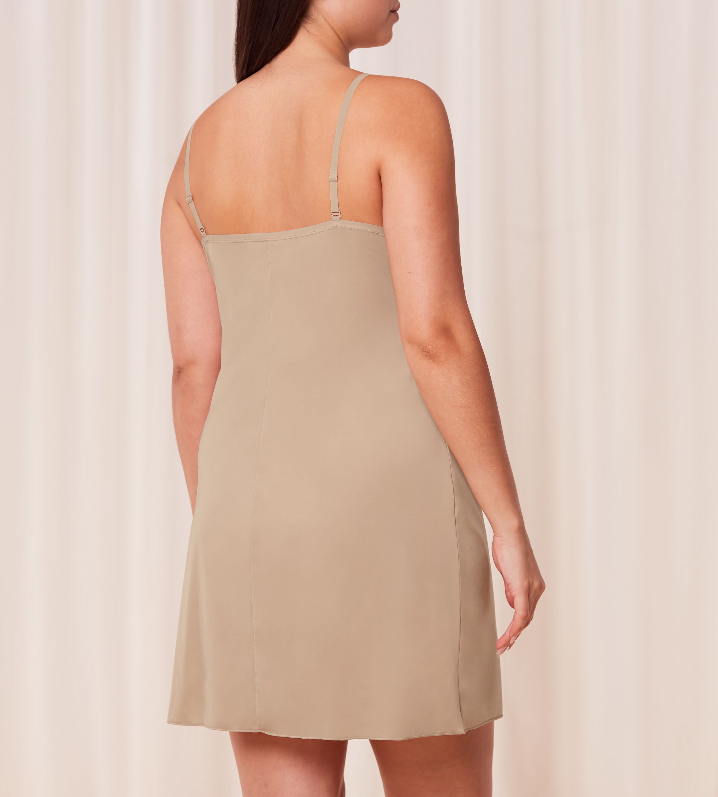 Triumph Body Make-Up beige body dress model back view, showing the adjustable straps and the seamless hemline. Now Available Online