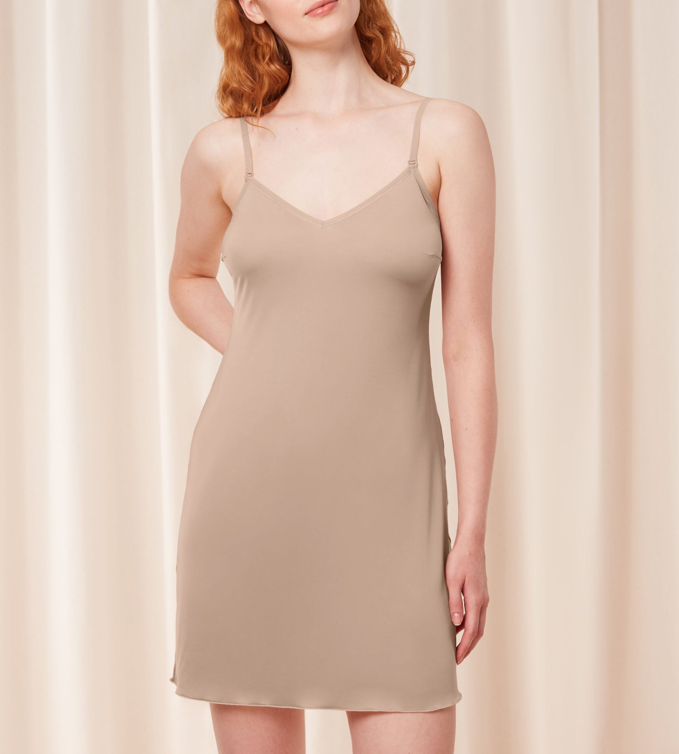 Triumph Body Make-Up beige body dress second model front view, showing the integrated padded cups and smooth, seamless hemline. Now Available Online