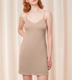 Triumph Body Make-Up beige body dress second model front view, showing the integrated padded cups and smooth, seamless hemline. Now Available Online