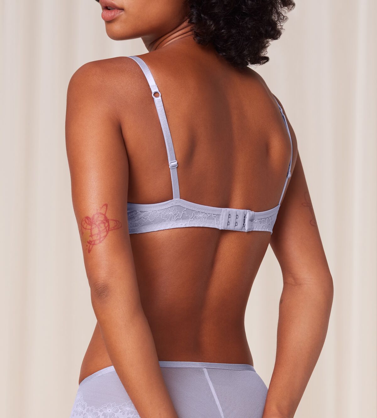 Triumph Bright Spotlight lilac wired push-up bra model back view, highlighting the adjustable straps and the intricate floral lace. Shop the Latest Online