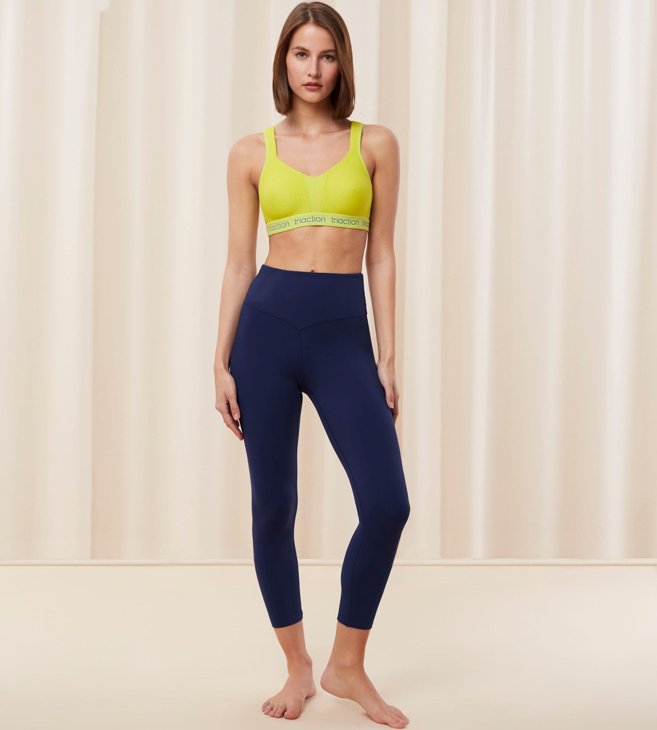 Triumph Cardio RTW high waist navy sports leggings model full front view, showcasing the compressive fit and smooth performance texture. Find Online Today