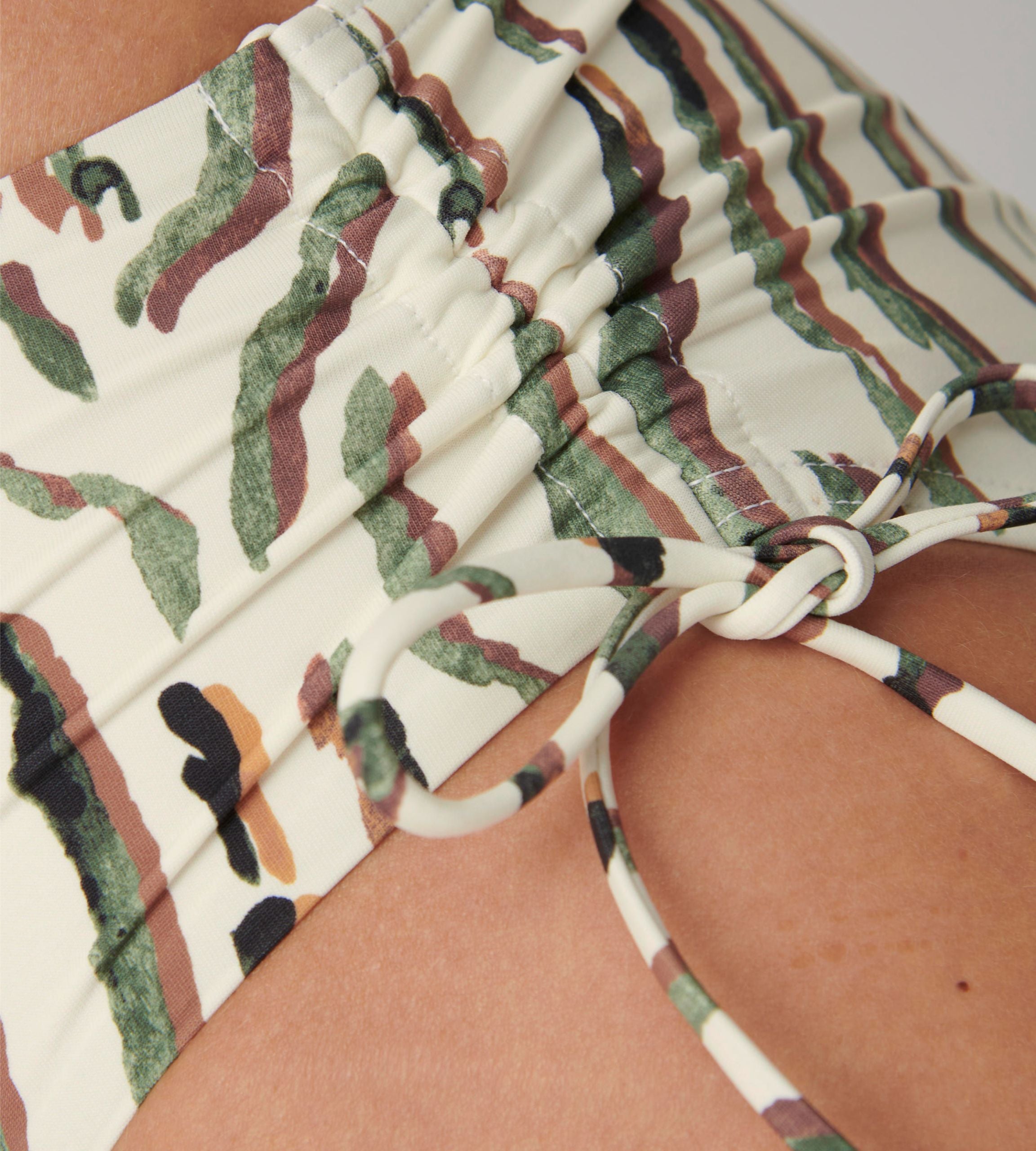 Triumph Charm Elegance 2.0 multicolored midi bikini bottoms close-up view, showcasing the artistic print and classic hip-fit design. Available Now Online