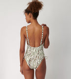 Triumph Charm Elegance 2.0 multicolored one-piece swimsuit model back view, showing adjustable straps, highlighting the ruched front and elegant artistic print. Shop Online Today