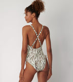 Triumph Charm Elegance 2.0 multicolored one-piece swimsuit model second back view, showing cross back straps, highlighting the ruched front and elegant artistic print. Shop Online Today