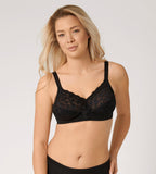 Triumph Delicate Doreen black non-wired bra model front view, highlighting the intricate lace cups and supportive wide straps. Shop the Latest Online
