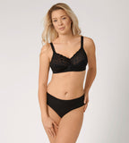 Triumph Delicate Doreen black non-wired bra model full front view, highlighting the intricate lace cups and supportive wide straps. Shop the Latest Online