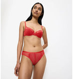 Triumph Delightful Spotlight red Brazilian panty model full front view, showcasing the graphic lace and low-coverage design. Order Online Today
