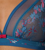 Triumph Electra Spotlight blue non-wired bra close-up view, highlighting the triangle lace cups and deep blue color with floral design. Find Online Now