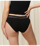 Triumph Feel Of Modal black tai panties model back view, showcasing the high-cut leg and decorative lace waistband. Shop Now Online