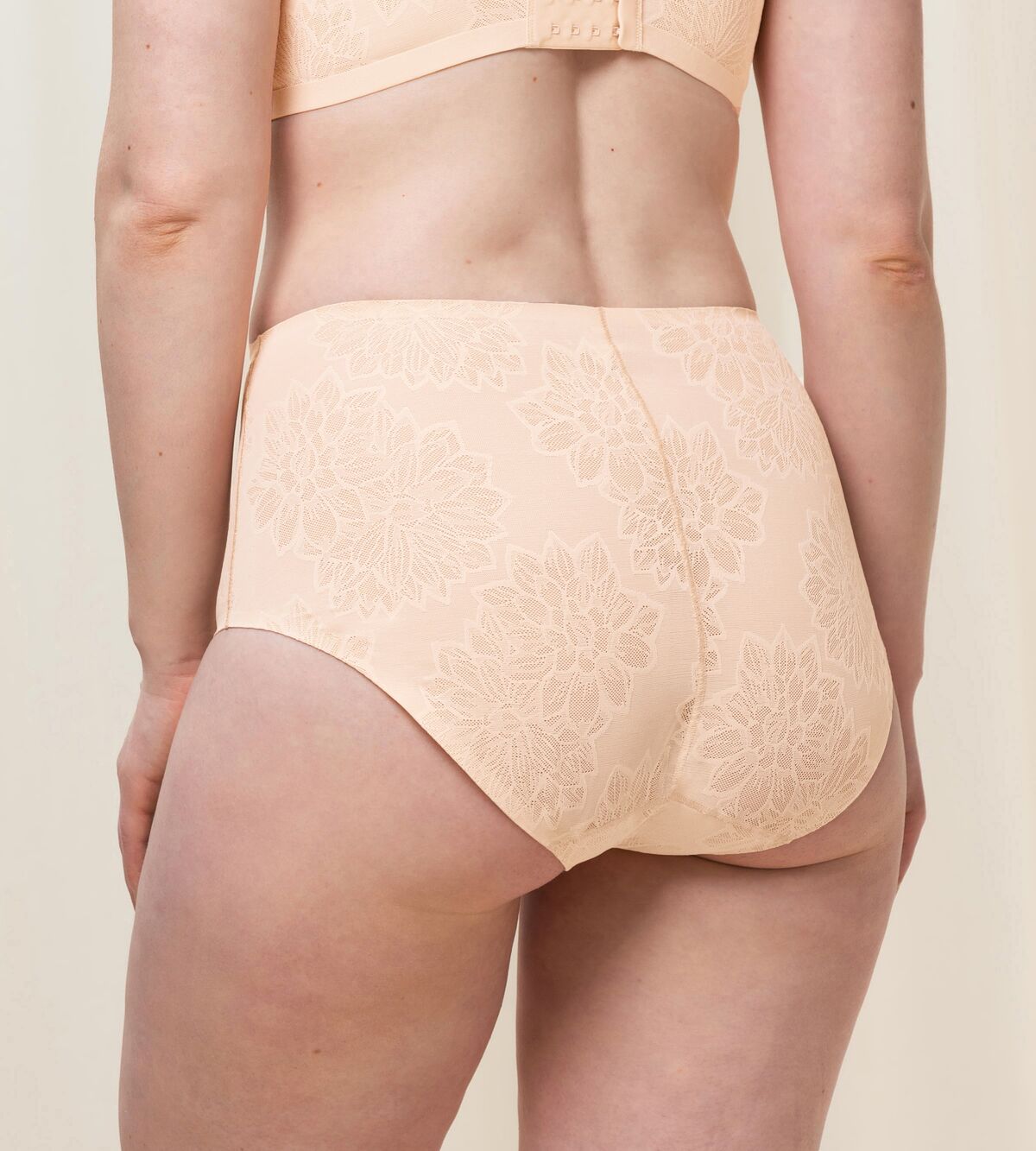 Triumph Fit Smart light beige maxi panty model back view, highlighting the floral 4D stretch lace and high-waisted silhouette. Available for Online Purchase