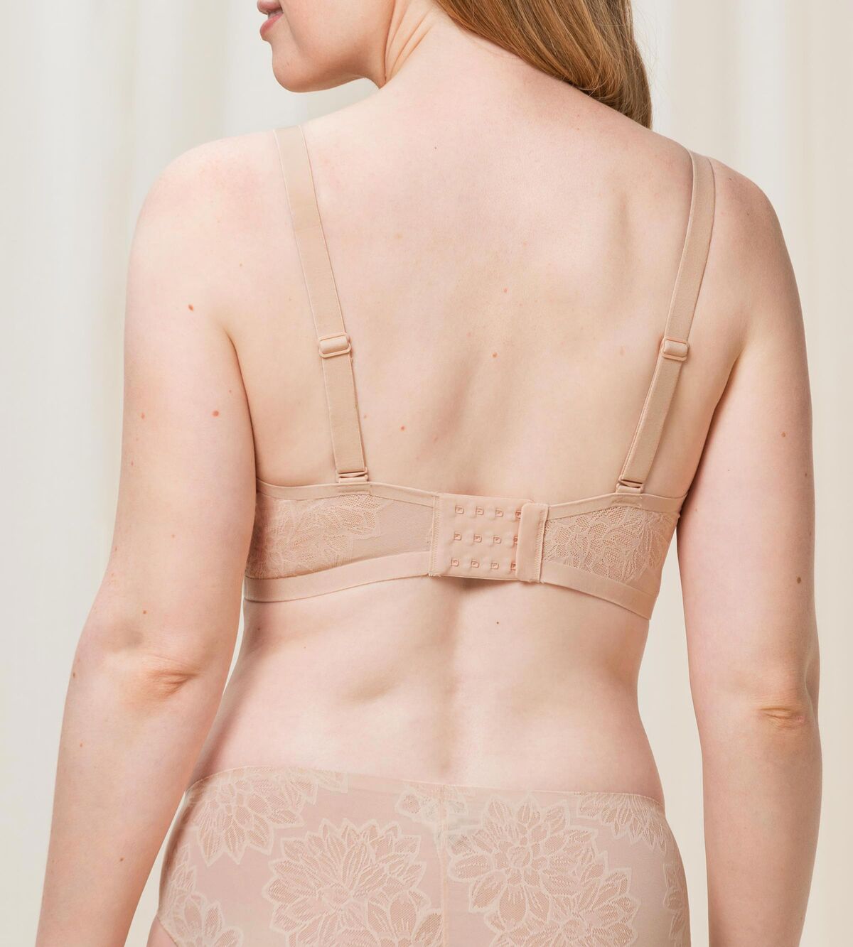 Triumph Fit Smart light beige padded bra second model back view, showing the decorative 4D lace and adjustable straps with back closure. Shop the Latest Online