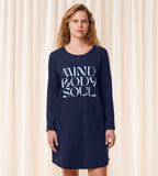 Triumph Lounge-Me cotton navy long-sleeved nightdress model front view, with a round neckline and knee-length hem. Shop Now Online