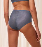 Triumph Signature sheer cloudy blue maxi panty model back view, showing fit and a geometric monogram pattern. Order Online Today