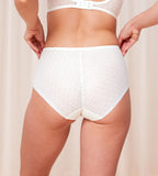 Triumph Signature sheer white maxi panty model back view, showing fit with geometric monogram mesh. Available Online Now