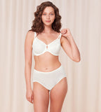 Triumph Signature sheer white minimizer bra model full front view, featuring geometric mesh. Shop Now Online