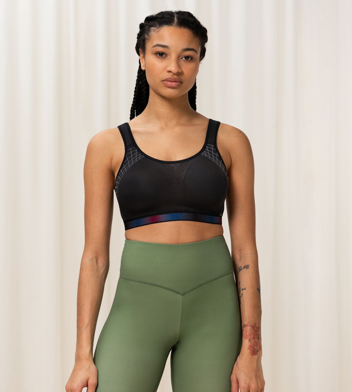 Triumph Triaction Cardio Cloud Black Sports Bra model full body front view, now available online