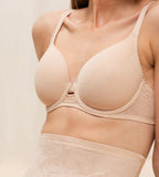 Triumph Wild Rose Sensation beige padded wired bra model side view, with floral lace pattern. Shop the latest online
