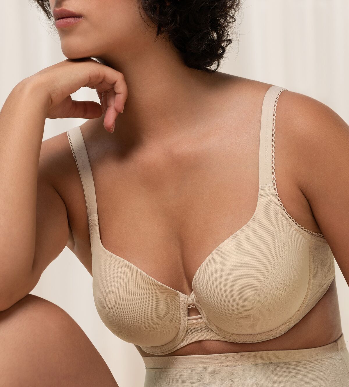 Triumph Wild Rose Sensation beige padded wired bra second model close-up view, with floral lace pattern. Shop the latest online