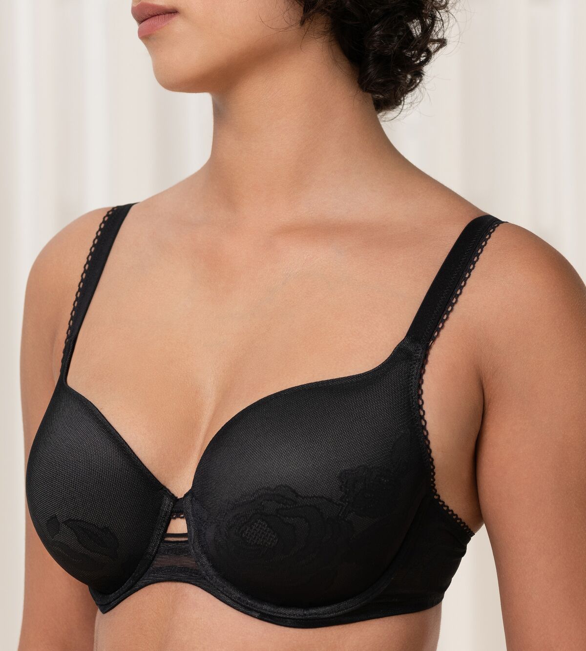 Triumph Wild Rose Sensation black padded wired bra close-up side view, detailing floral lace. Find Online Now
