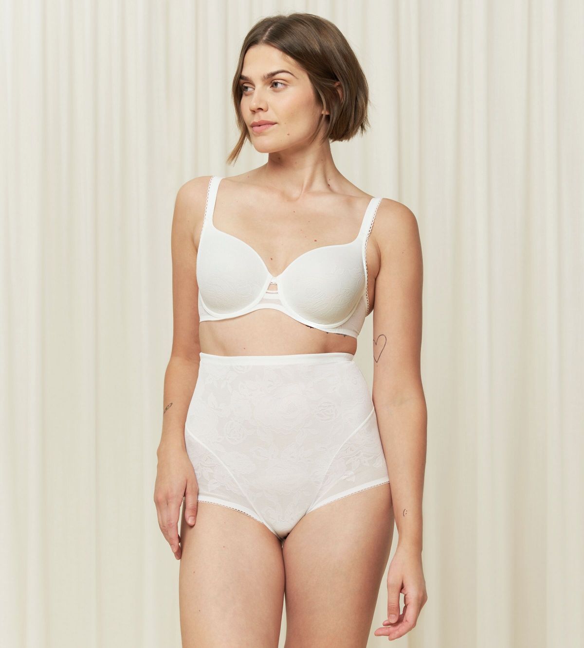 Triumph Wild Rose Sensation wired white padded bra model front view, with floral lace detailing - Order Online Today
