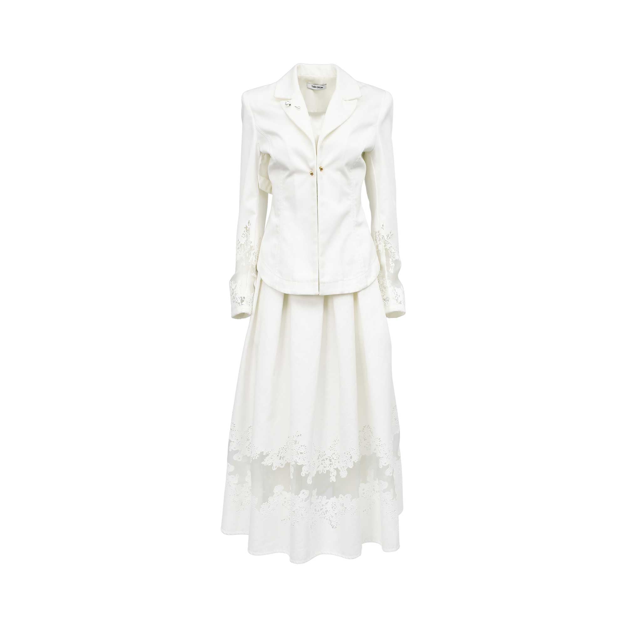 Front view of a women's luxury off-white two-piece set by Tuba Ergin, featuring a structured tailored blazer with gold hardware and a pleated maxi skirt, both finished with sheer panels and intricate white guipure lace detailing.