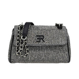 Ermanno Firenze tweed shoulder bag featuring a black and white herringbone pattern, chain strap with leather detail, and signature ER logo on the flap.