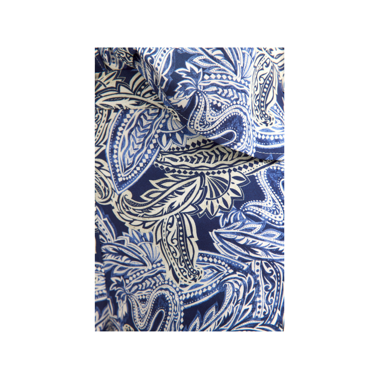 Navy blue trousers with an intricate white and light blue paisley and floral pattern.