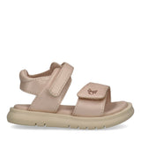 Light pink open-toe sandal with two Velcro straps, one over the forefoot with a gold-toned emblem, and one around the ankle.