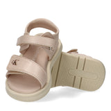 Light pink velcro sandals with thick cream soles. Features three adjustable straps and a gold-toned CK logo on the front stra
