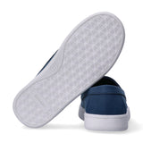 Blue low-cut slip-on sneaker. White sole with repeating 'CK' logo pattern, 'Calvin Klein' text, and circled '31'.